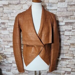 Marciano Los Angeles Asymmetrical jacket with a one-button closure.